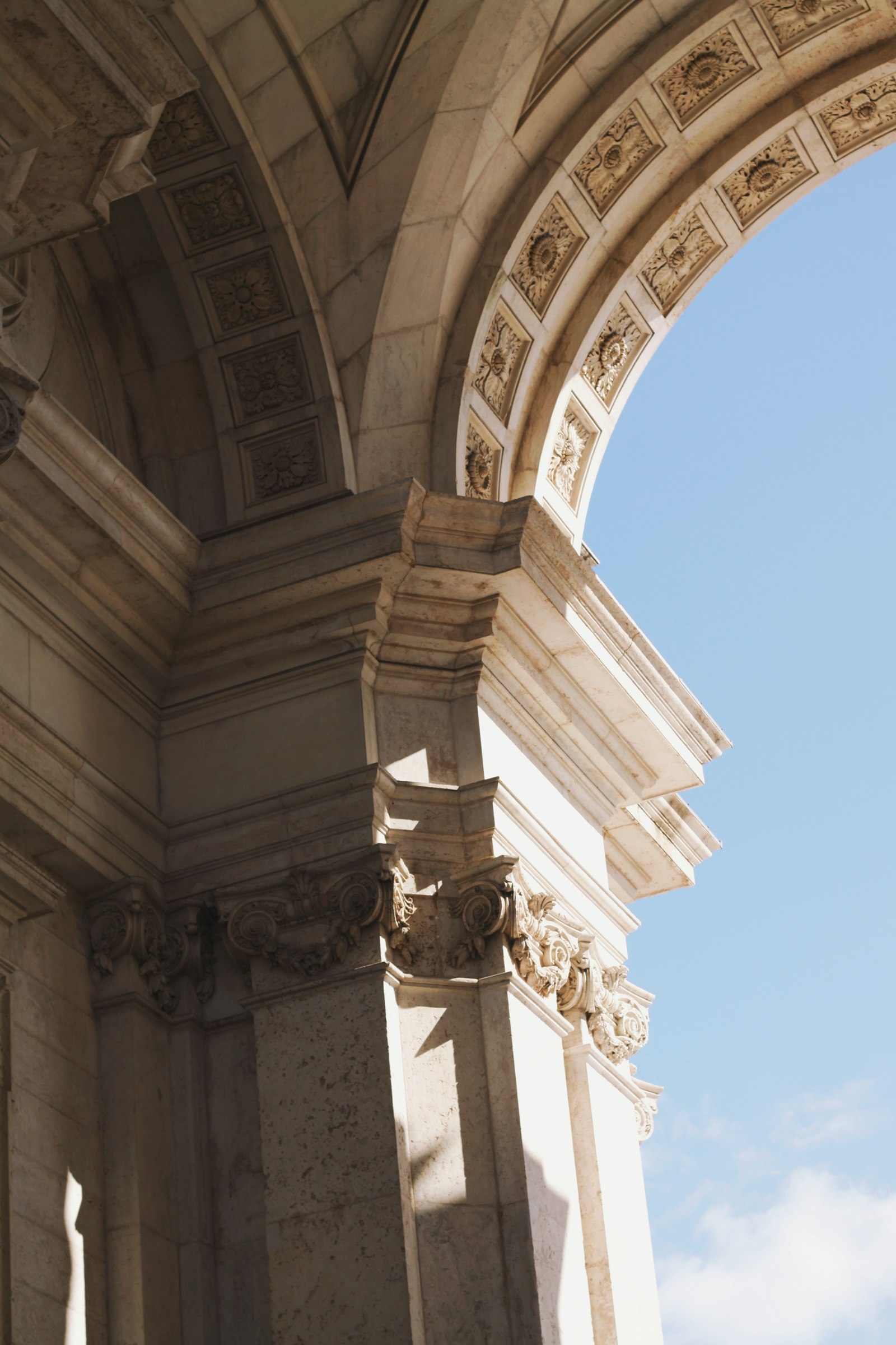 Stone archway of a historic building against the sky