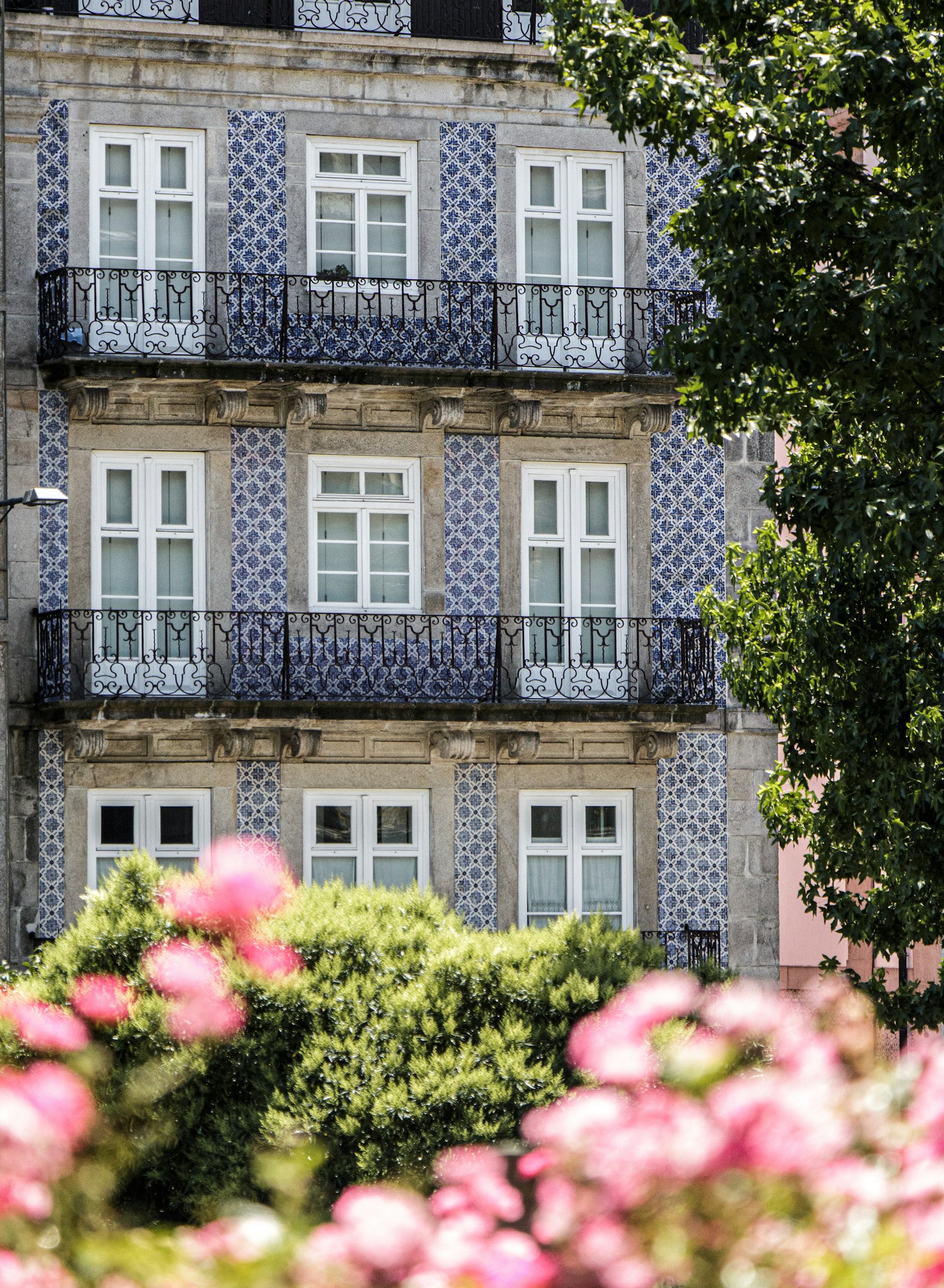 Tiled facade of a Porto building with balconies