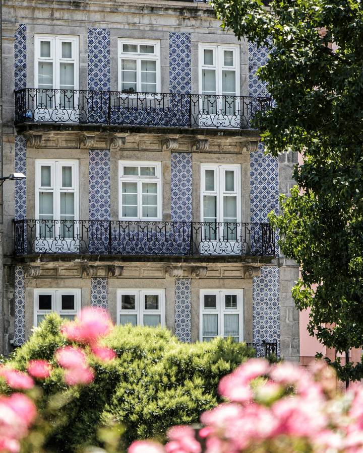 Tiled building facade with iron balconies